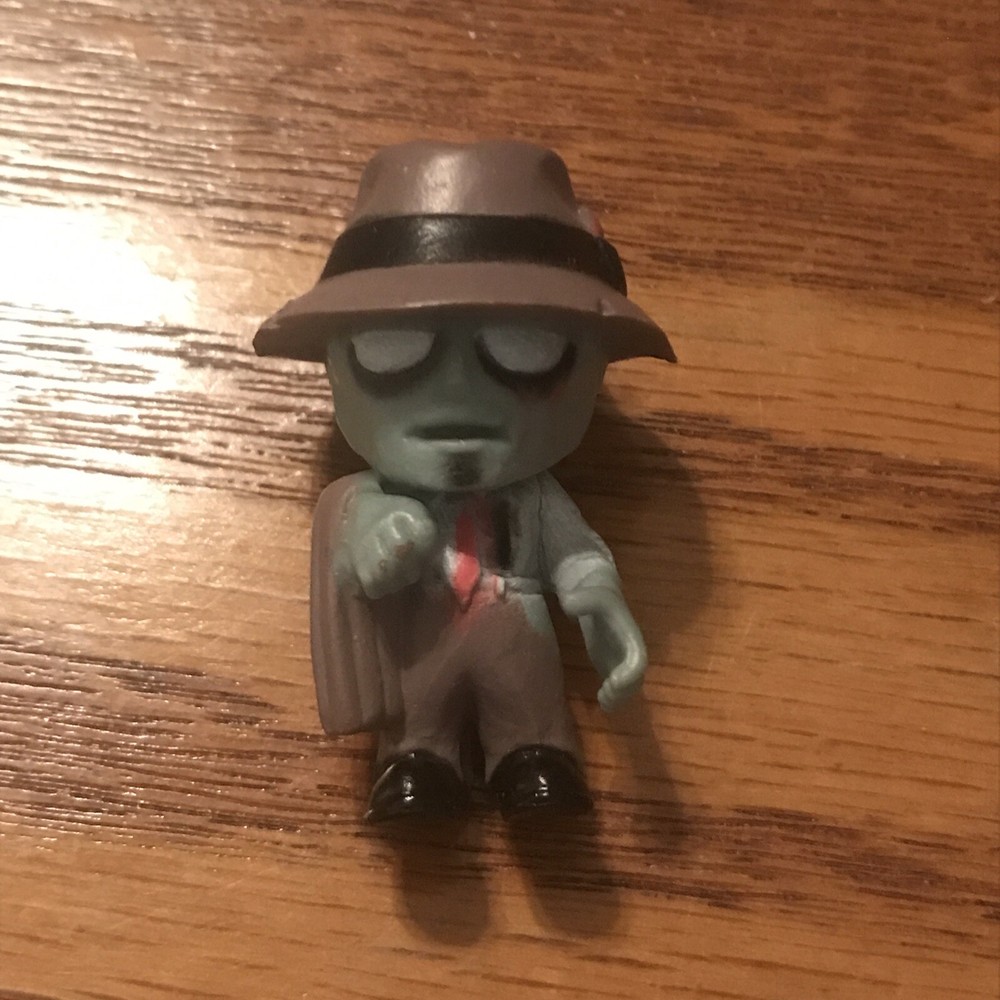 Mystery Mini Green Farmer Zombie 2” Plastic Vinyl